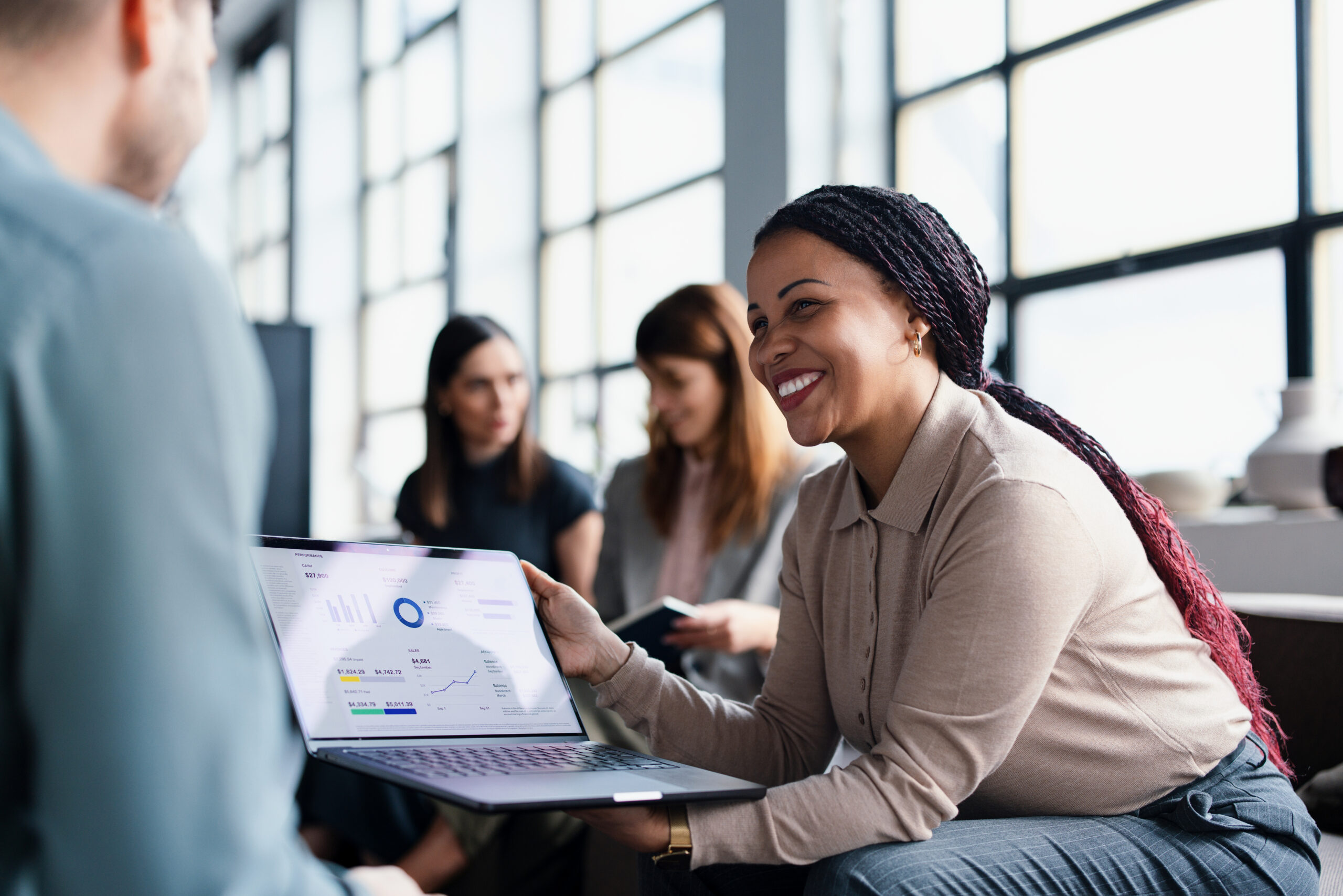 Black female executive presenting financial results