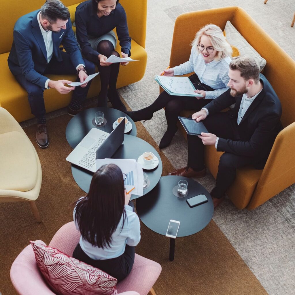 Leadership team comparing documents during an evidence review