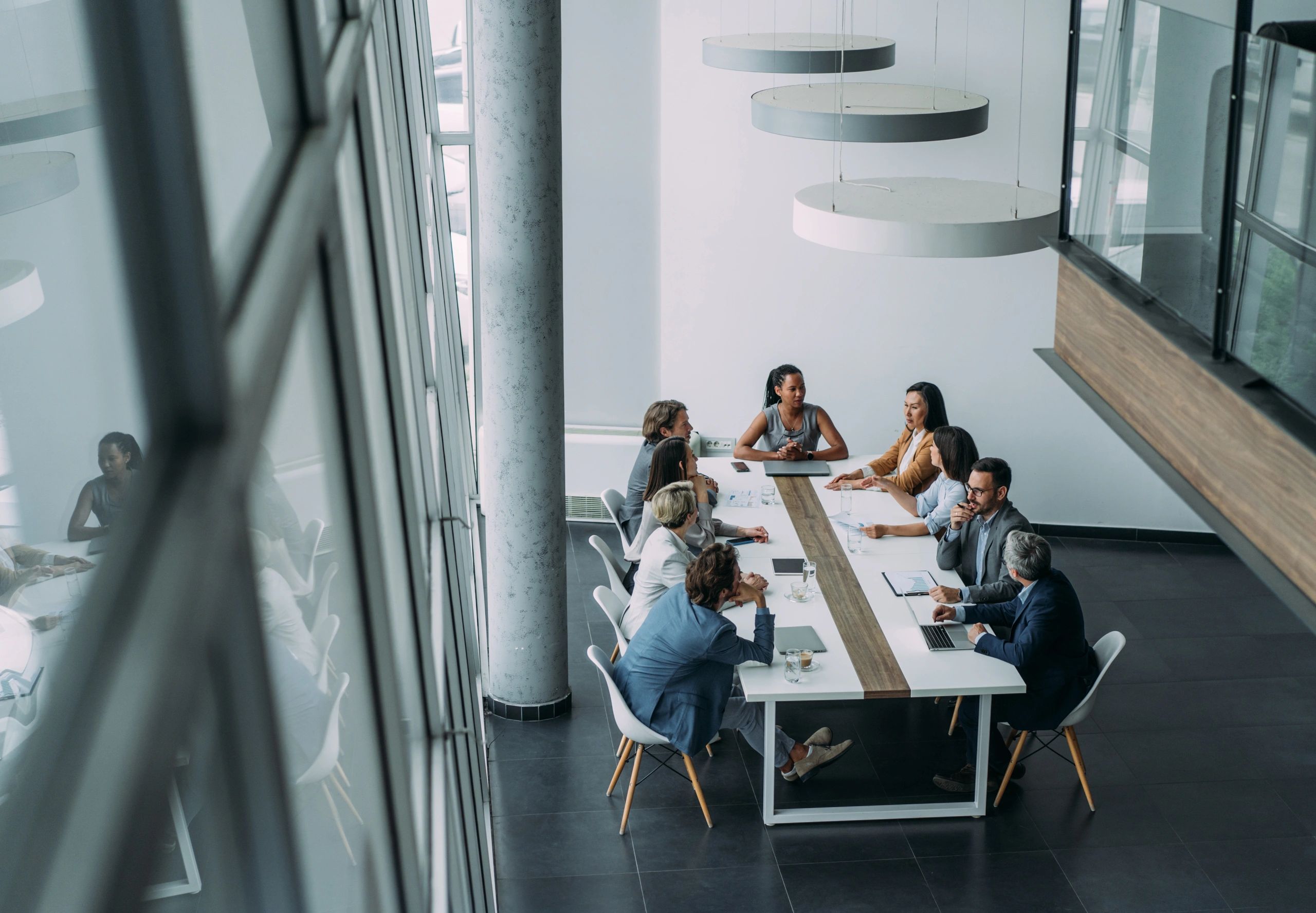 Diverse executive boardroom meeting