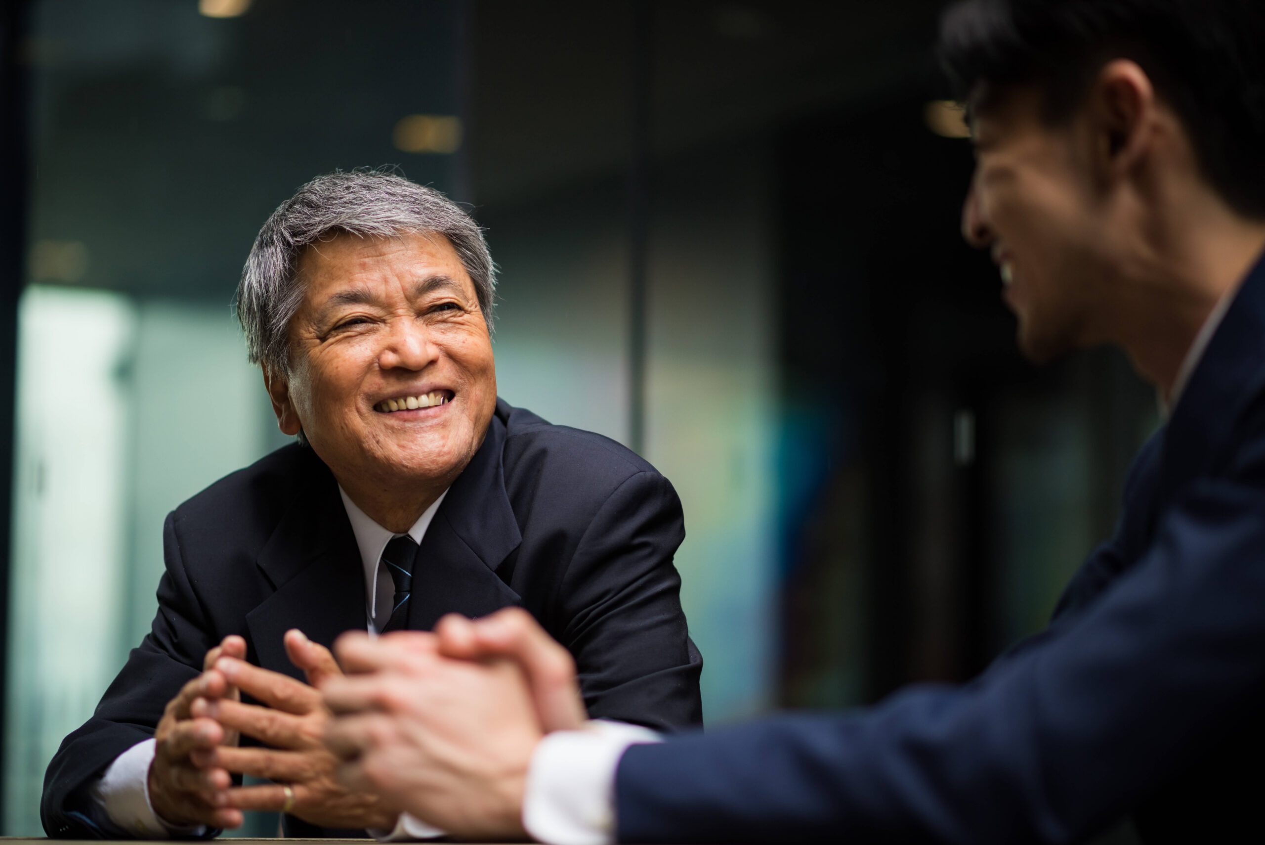 Senior asian executive private conversation