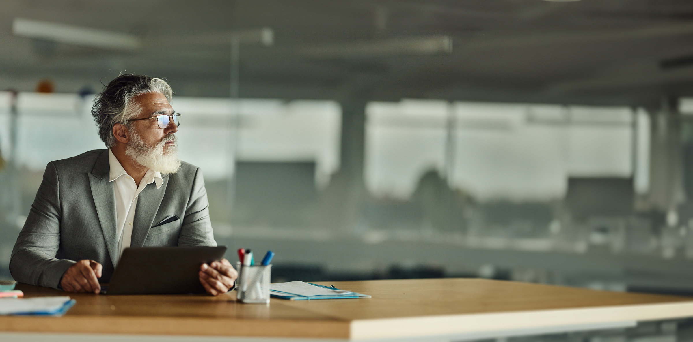 Senior executive reflecting modern office