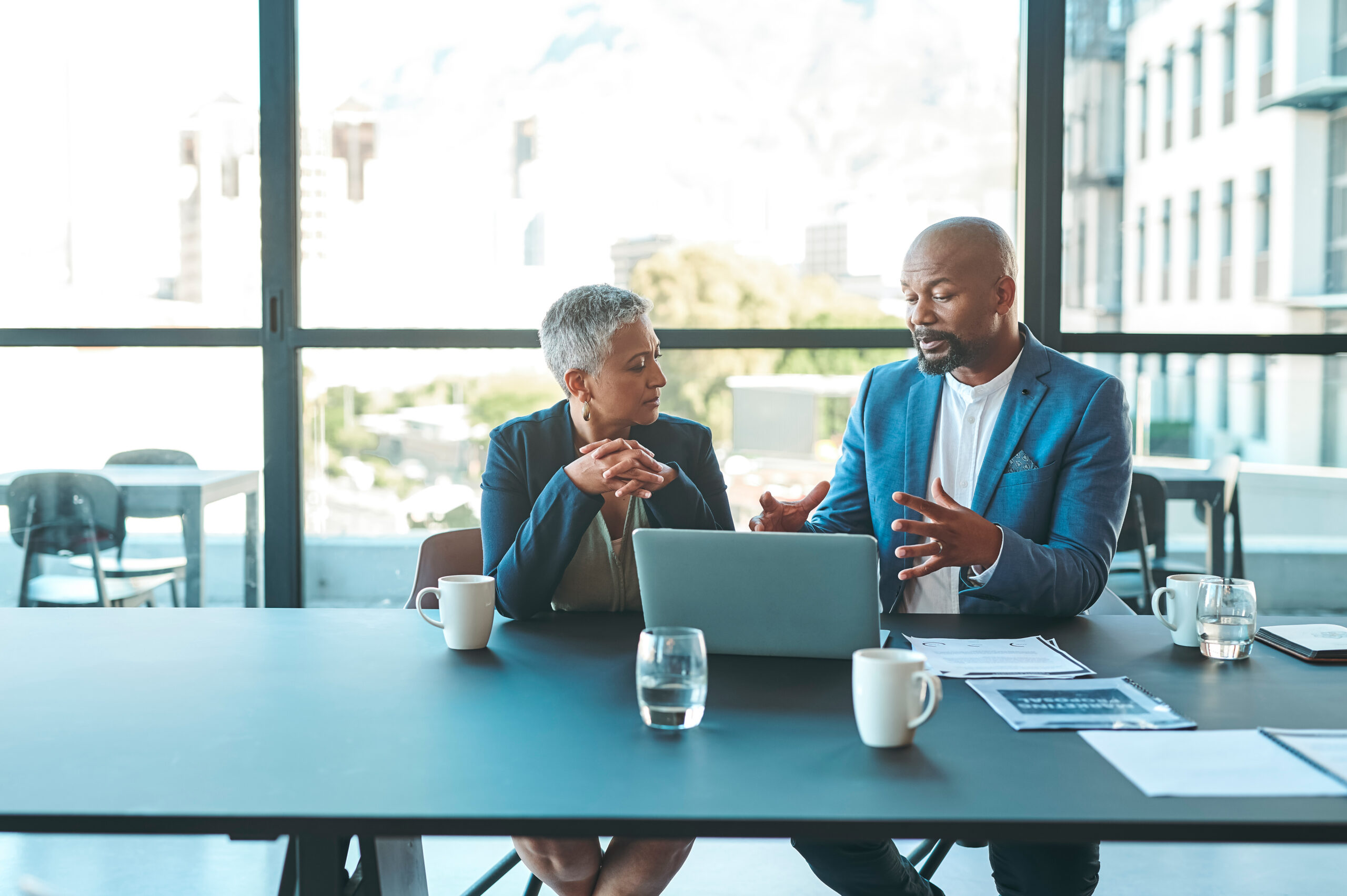 Senior executives boardroom discussion