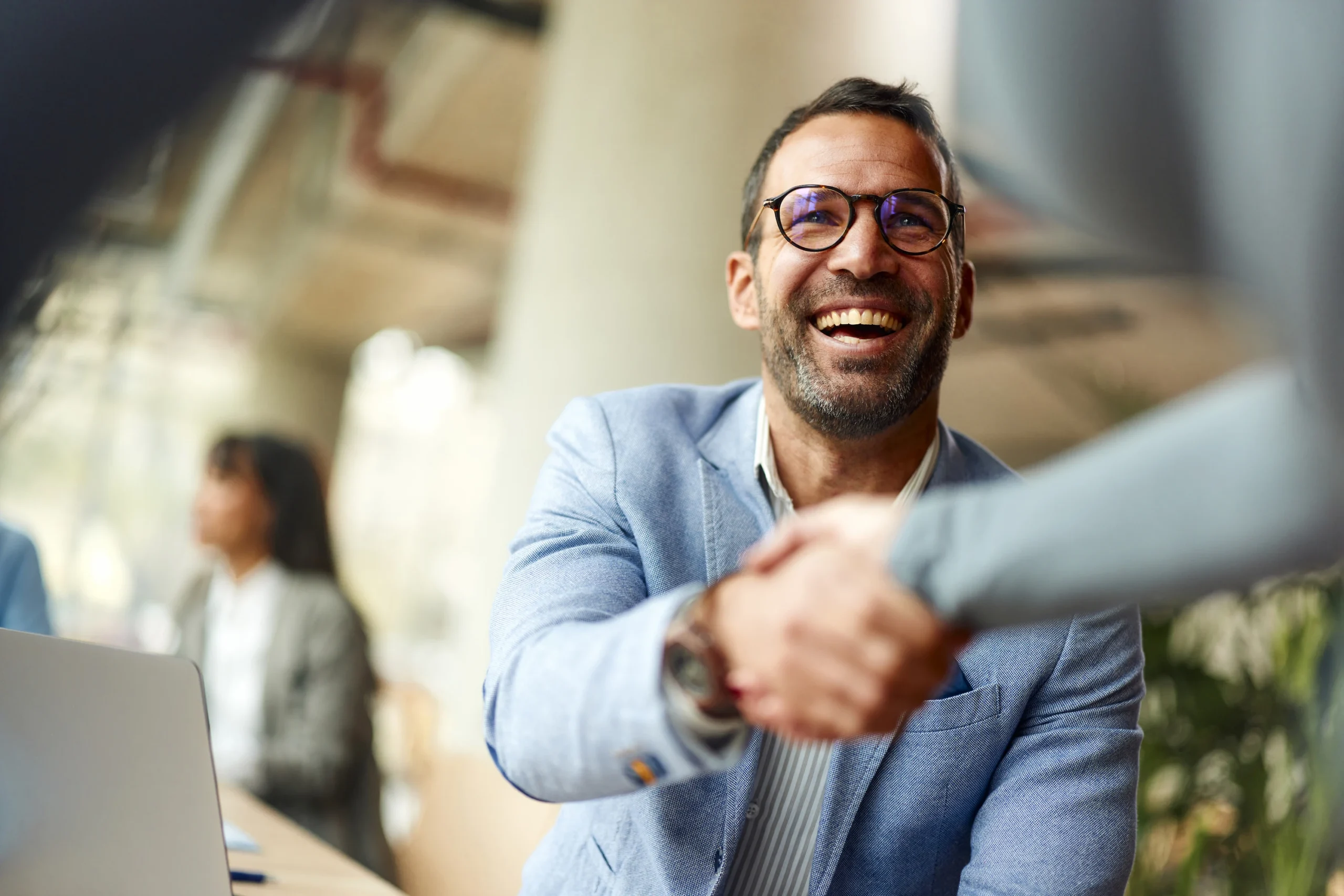 Smiling male executive conversation