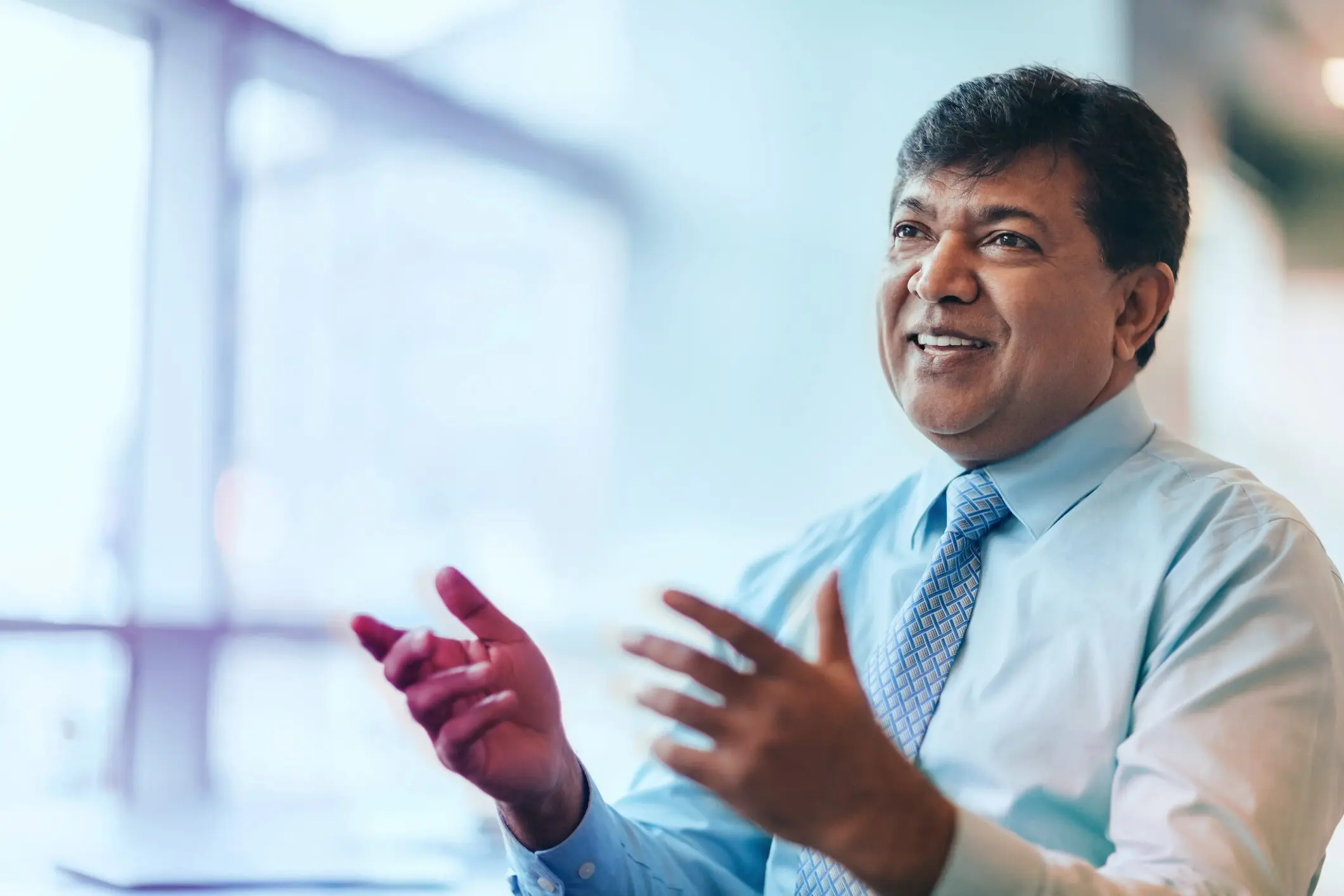 South asian male executive team conversation