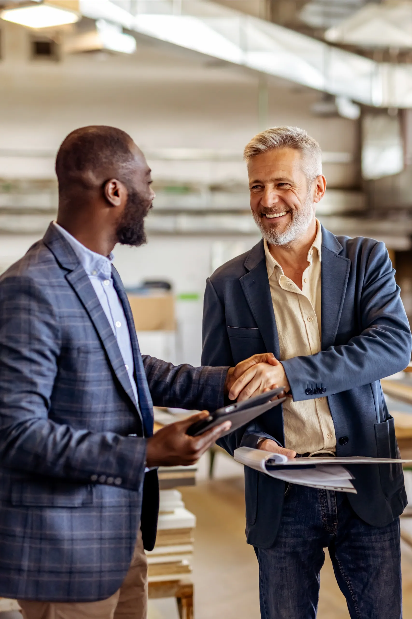 Two business leaders confirming a confidential partnership