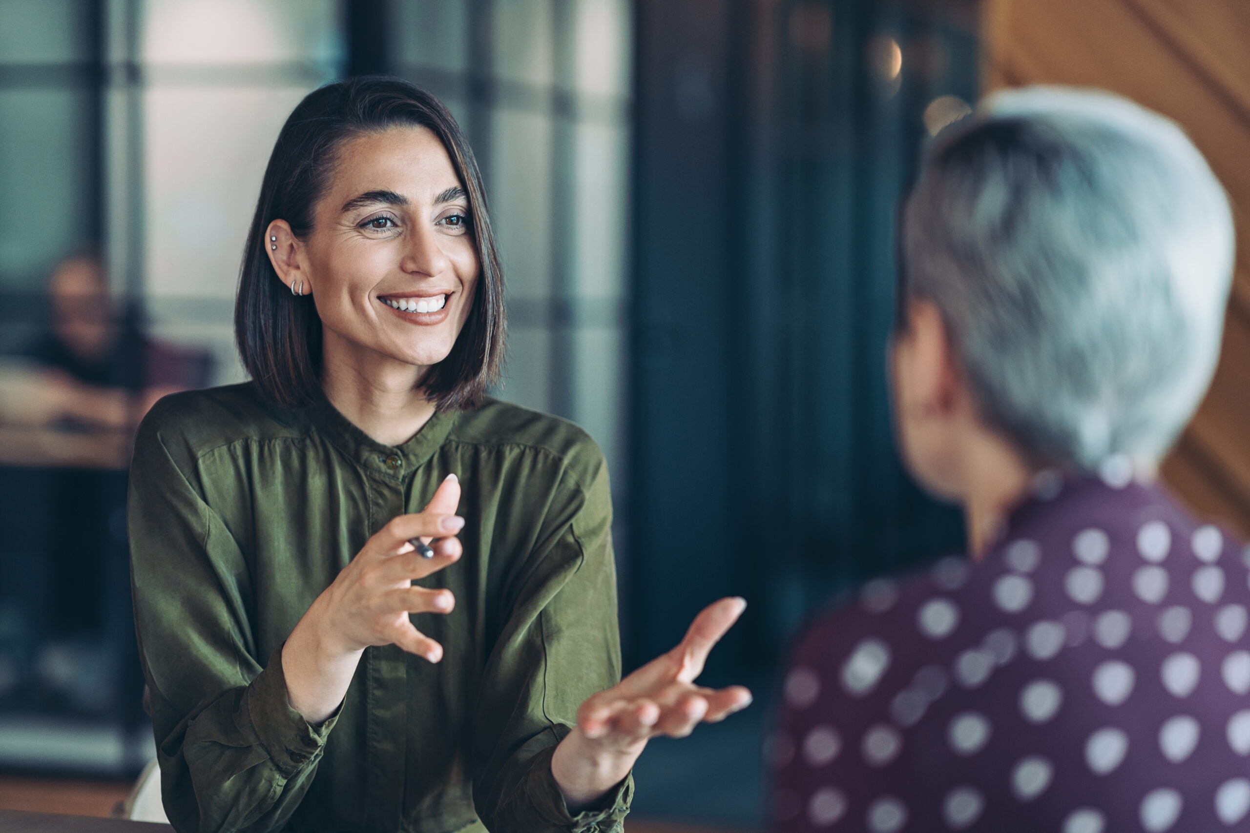 Female executive in a confidential client conversation
