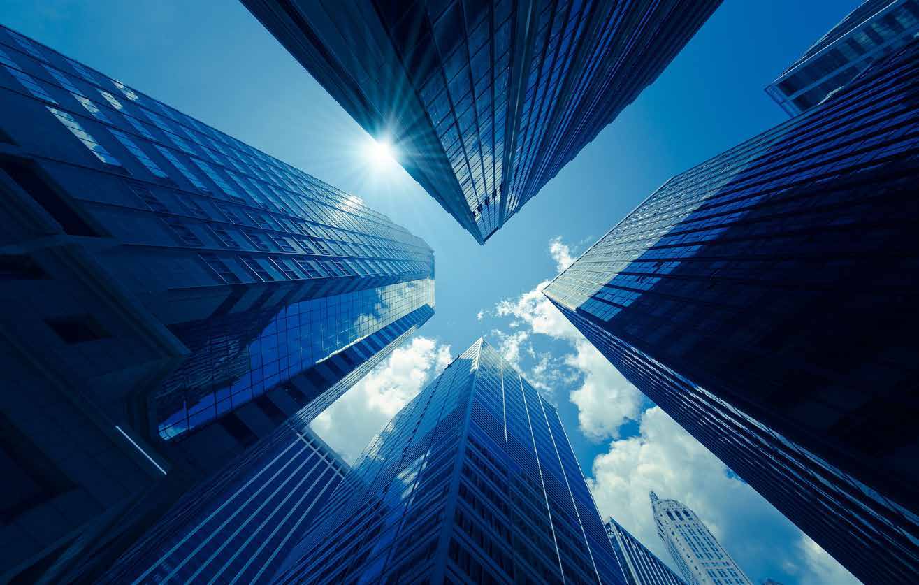 Skyscrapers viewed from below representing hidden executive hiring risks