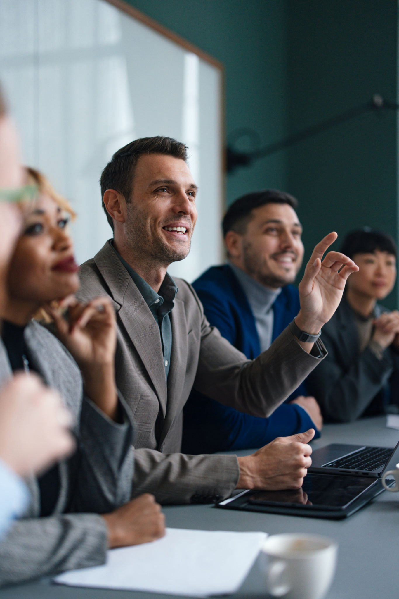 Executives contributing during a leadership meeting