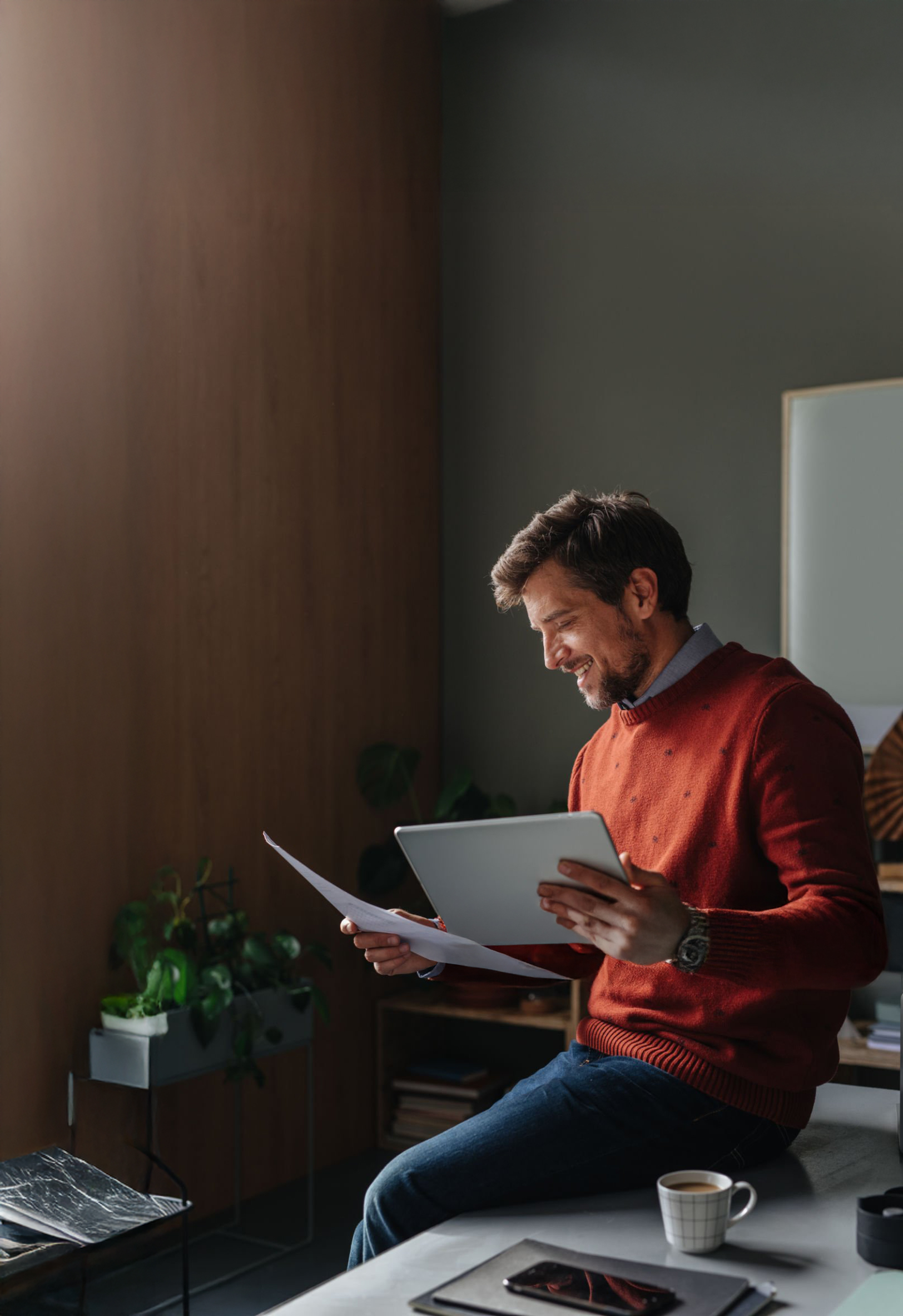 Executive reviewing confidential documents at home
